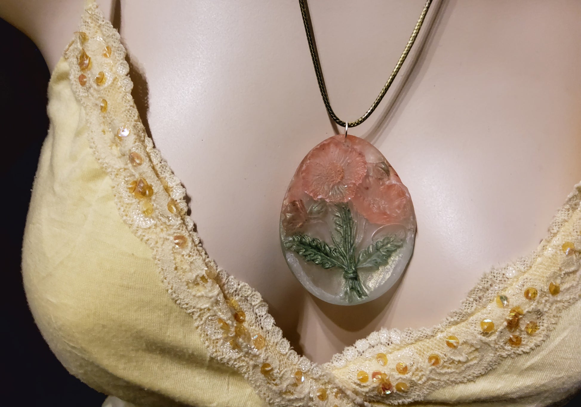 3D resin oval necklace peach blossom green on mannequin front view