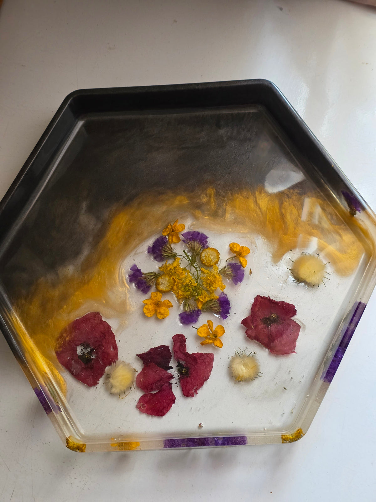 Hexagonal resin tray with dried flowers and gold amber swirls - top view