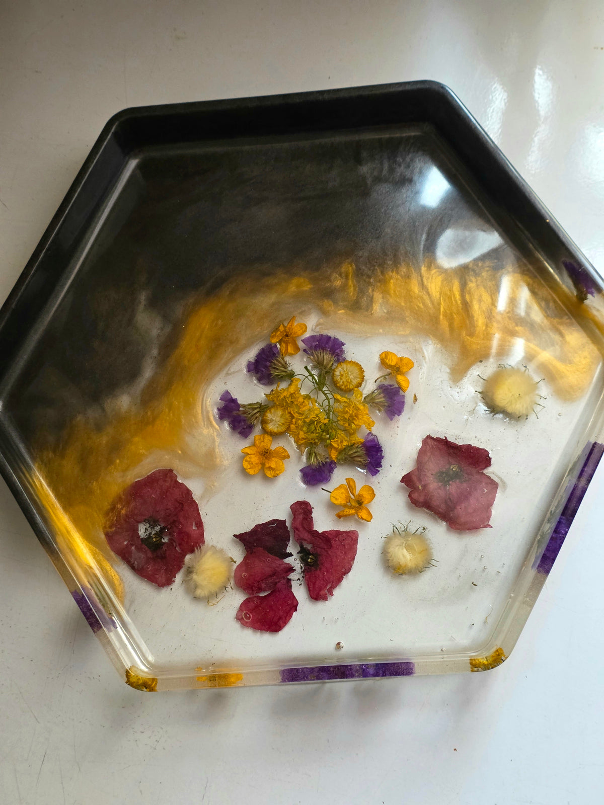 Hexagonal clear resin tray with botanical flowers and purple corner accents - side angle