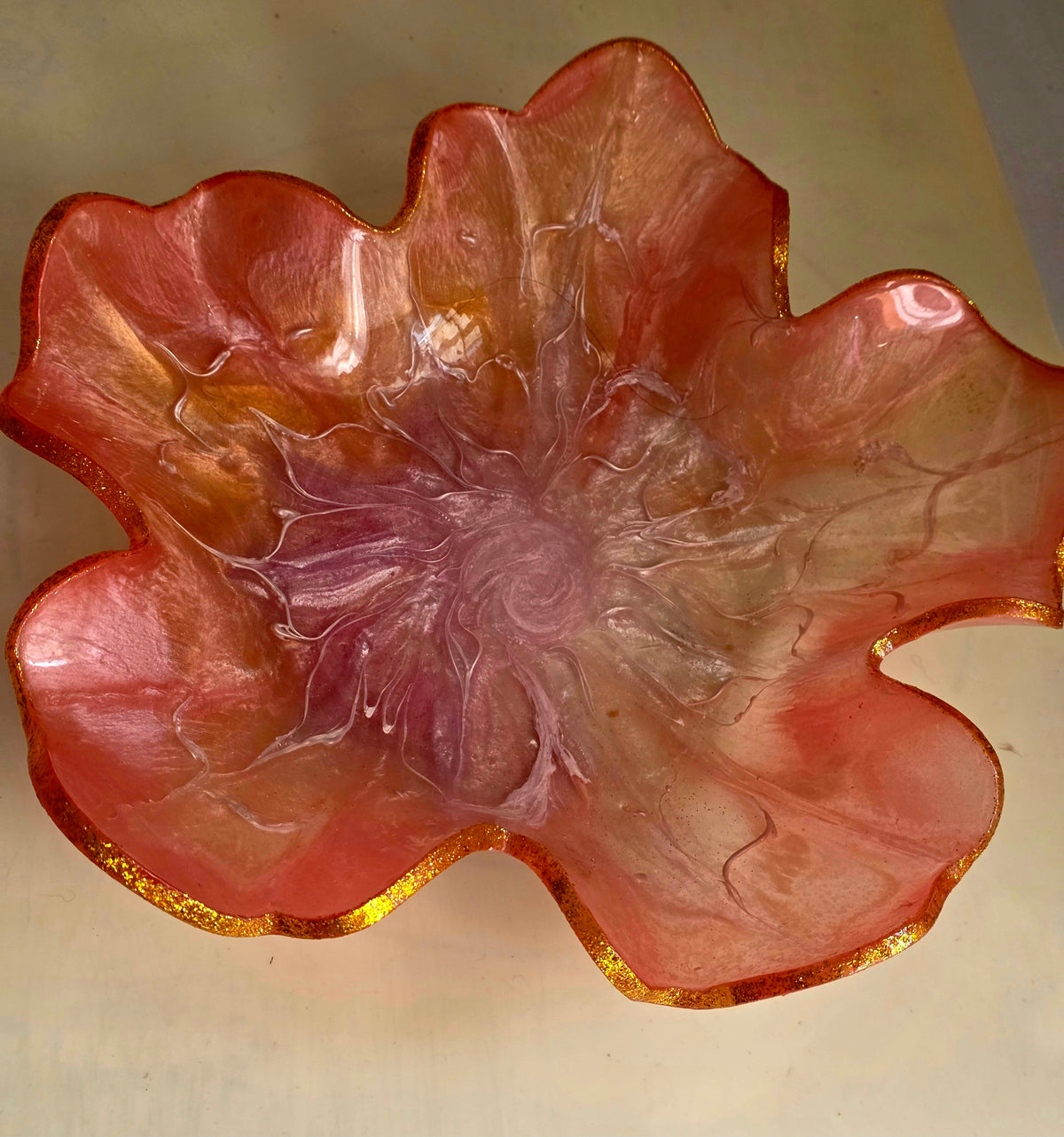 Freesia pink resin flower bowl - side profile in hand
